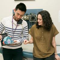 Seam and Blanka look at a medical diagram.